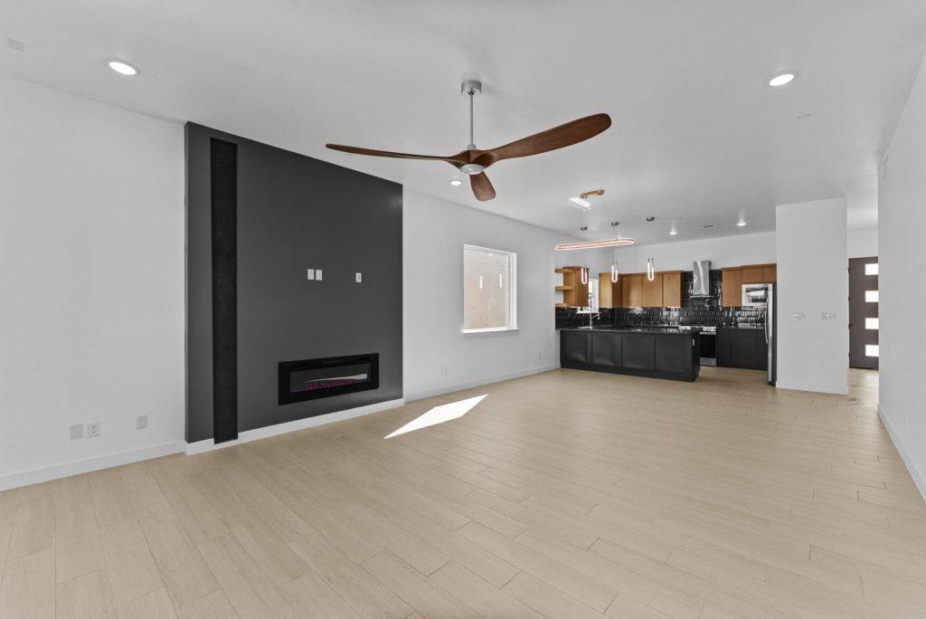Great room with fireplace in a Hyperion M floorplan home by Nueva Luna Builders in El Paso, Texas