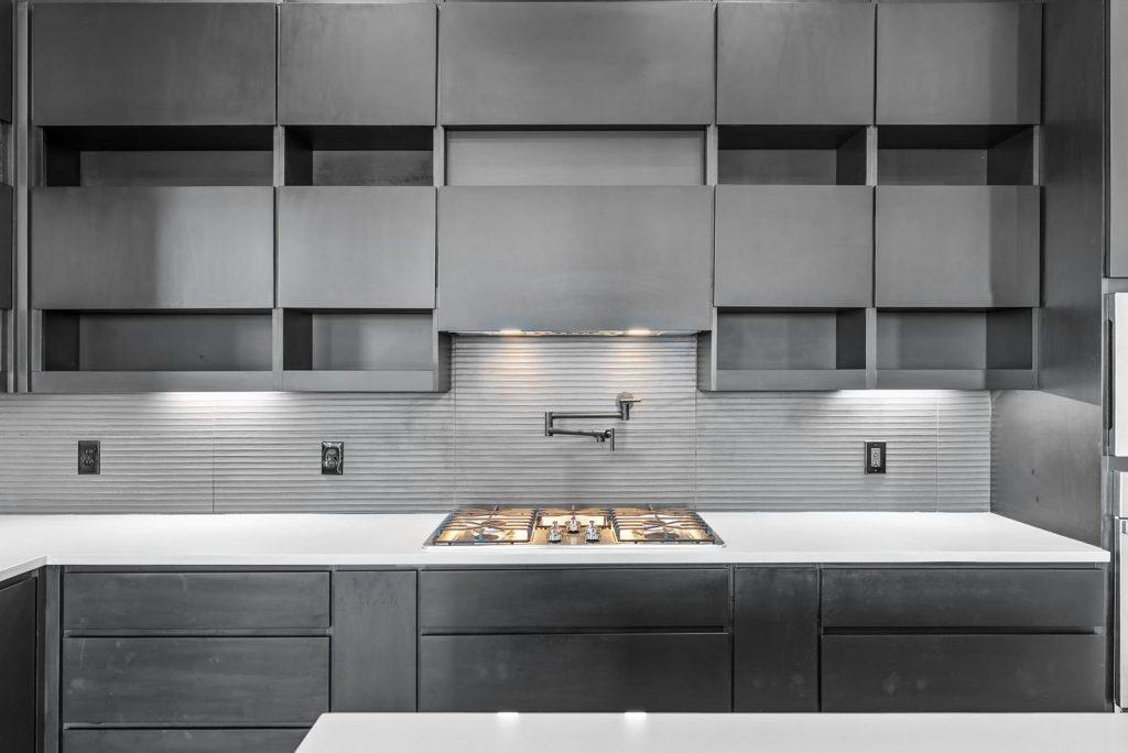 Cooktop & Open Shelving in an Io M SE floorplan home by Nueva Luna Builders in El Paso, Texas