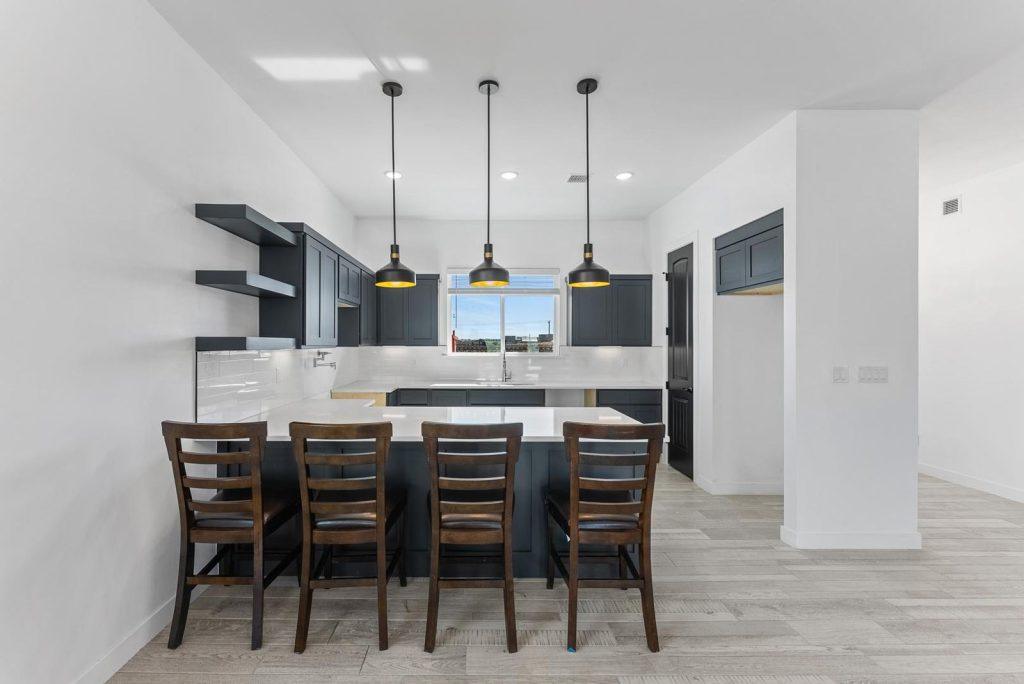 Kitchen & Bar in a Phoebe T floorplan home by Nueva Luna Builders in El Paso, Texas